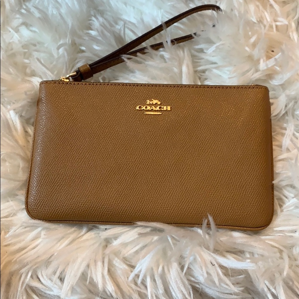 Tan leather Coach clutch/wristlet.